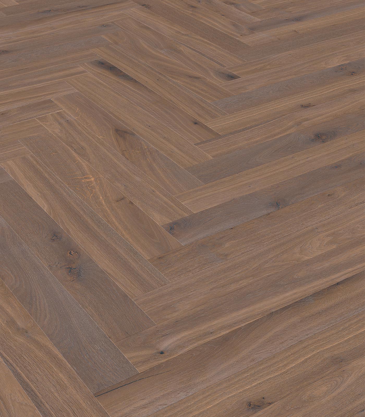 Herringbone Biarritz warm grey wide plank hardwood — angle view